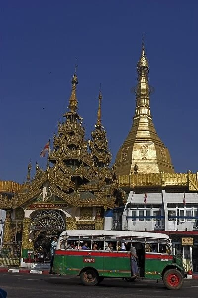 Public bus drives past Sule Pagoda, Yangon (Rangoon), Myanmar (Burma), Asia