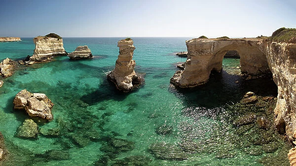 Rock stacks and crystal clear sea of the Faraglioni di Sant Andrea, Torre di Sant Andrea, Melendugno, Lecce Province, Puglia, Italy, Europe