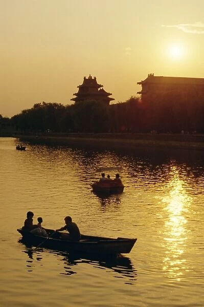 Rowing boats on lake near the Forbidden City, Beijing, China