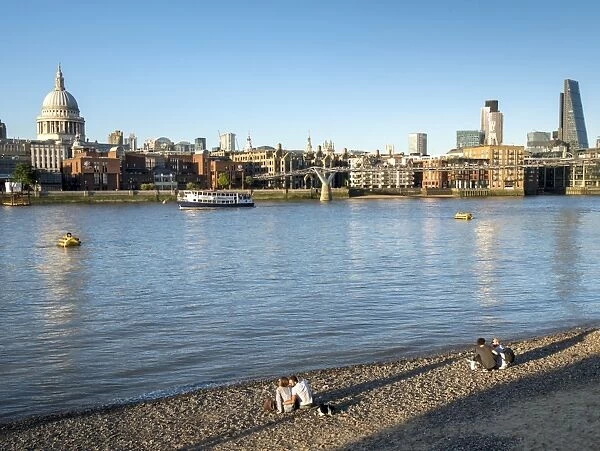 St. Pauls and City skyline, beach beside the River Thames, London, England, United Kingdom