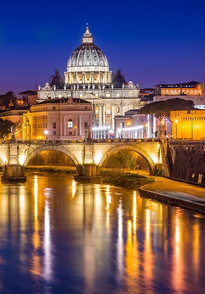 St. Peters Basilica in Vatican City lit up after dark and Tiber River, Rome, Lazio