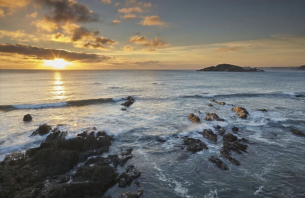 Sunset on the south coast of Devon, seen from Bantham and looking over Burgh Island