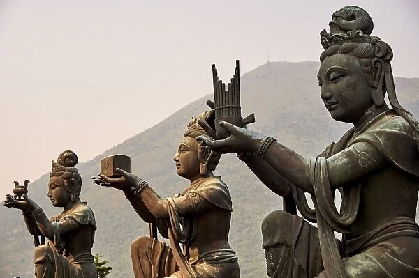 Supporting figures make offerings to Big Buddha, Po Lin Monastery, Ngong Ping, Lantau Island