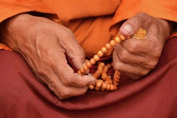 Tibetan monk holding prayer beads, Nepal, Asia