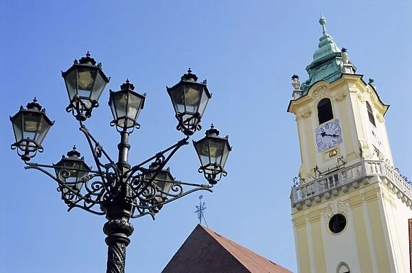 Tower of Old Town Hall and wrought iron 19th century street lamp