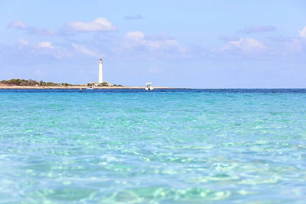 Turquoise sea with lighthouse in the background, San Vito Lo Capo, province of Trapani
