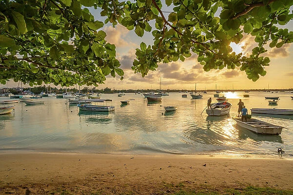 View of boats on the water in Grand Bay at golden hour, Mauritius, Indian Ocean, Africa