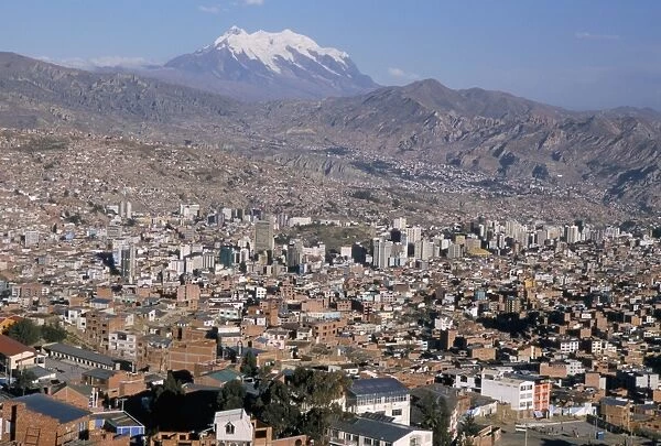 View across city from El Alto, with Illimani volcano in distance, La Paz