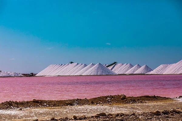 View of the pink colored ocean overlooking the Salt Pyramids of Bonaire from afar
