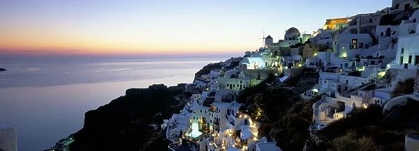 View over the town of Oia at twilight with Aegean Sea