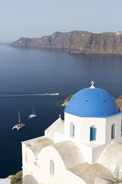 White church with blue dome overlooking the Caldera, Oia, Santorini, Cyclades Islands