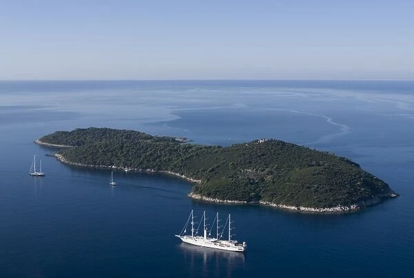 Yacht sailing round the island of Lokrum, part of the Elaphite Islands