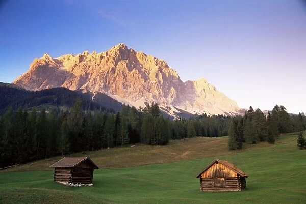 Zugspitze and barns at dusk, Wetterstein, Austrian Alps, Austria, Europe