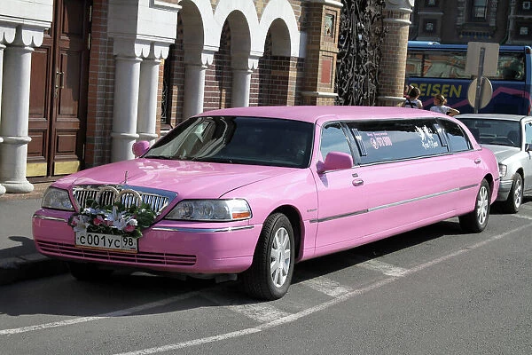 Pink stretch limousine car in St. Petersburg, Russia