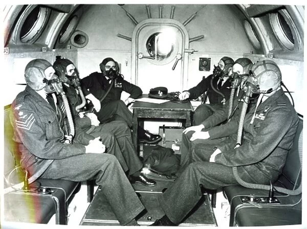 Crew and officers wear oxygen masks during a flight on a Vickers Valiant
