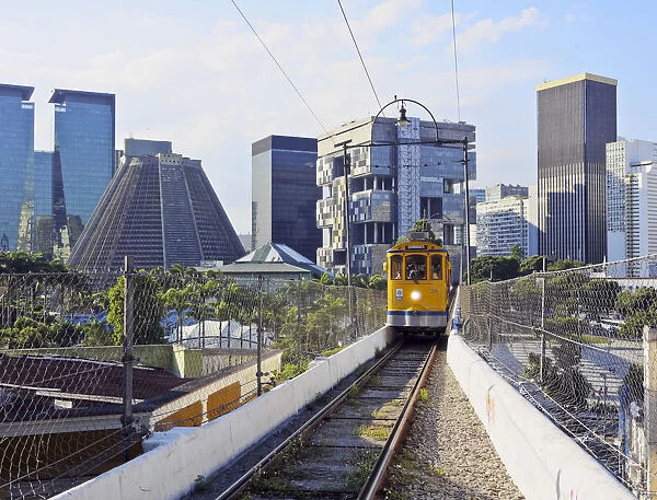 Brazil, City of Rio de Janeiro, Lapa, Yellow Tram crossing the Carioca Aqueduct with