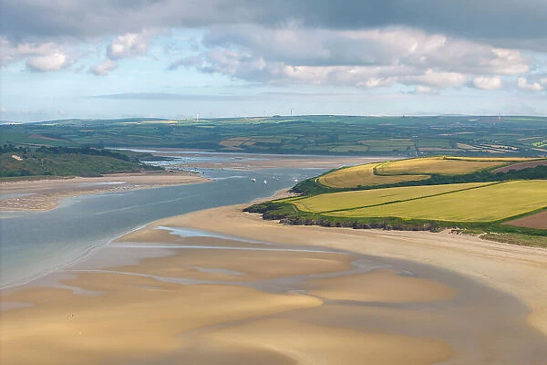 The Doom Bar is revealed at low tide in the Camel Estuary near Padstow, Cornwall, England. Summer (June) 2023