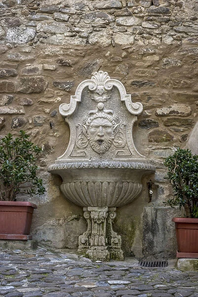 Europe, Italy, Liguria. Dolceacqua. Fountain in the town