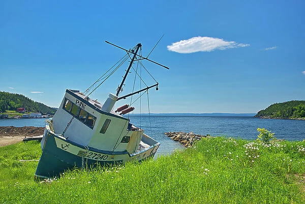 Fishing boat along the shoreline of White Bay. Baie Verte Peninsula. Newfoundland & Labrador, Canada