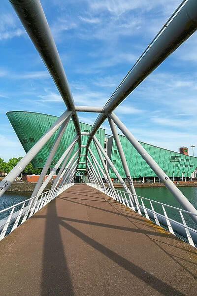 Mr J.J. van der Veldebrug bridge leading towards NEMO Science Museum, Oosterdok, Amsterdam, Netherlands