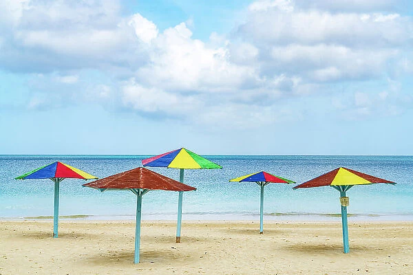 Multicolored beach umbrellas on a tropical shore, Antigua, Antigua & Barbuda, Caribbean, West Indies