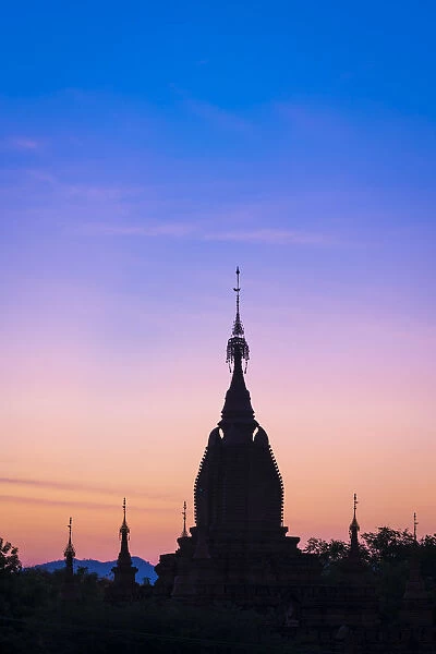Silhouette of old pagoda against purple sky during sunrise, Bagan, Mandalay Region