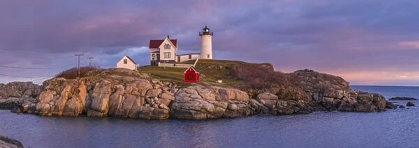 USA, Maine, York Beach, Nubble Light Lighthouse with Christmas decorations, dusk