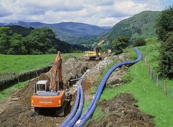 Laying a new water pipeline in the Lake District National Park Cumbria UK