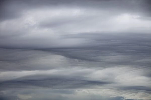 Patterns in cloud on an occluded front over the Lake District hills in Ambleside, Cumbria, UK