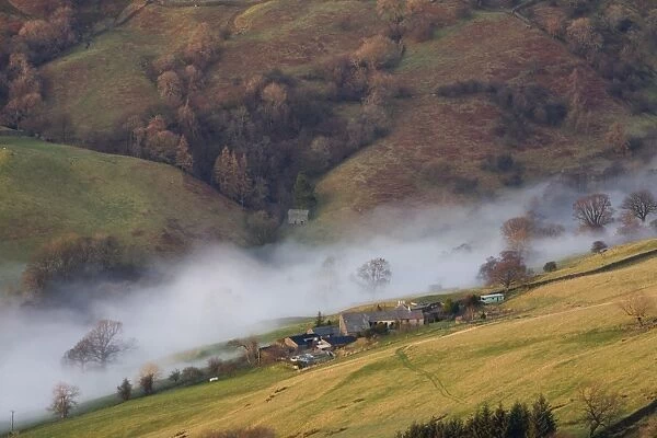 Valley Mist over Kirkstone near Ambleside from Wansfell Pike in the Lake District UK