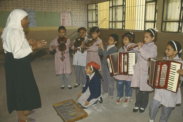 20004469. EGYPT Cairo Childrens music lesson in state school