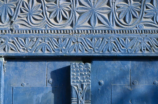 20070940. SOMALIA Mogadishu Detail of blue painted doorway with carved plant motif