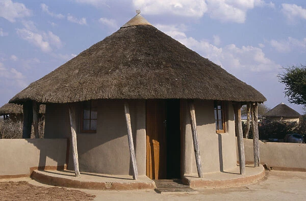 20074688. BOTSWANA Kopong Traditional circular hut with thatched roof