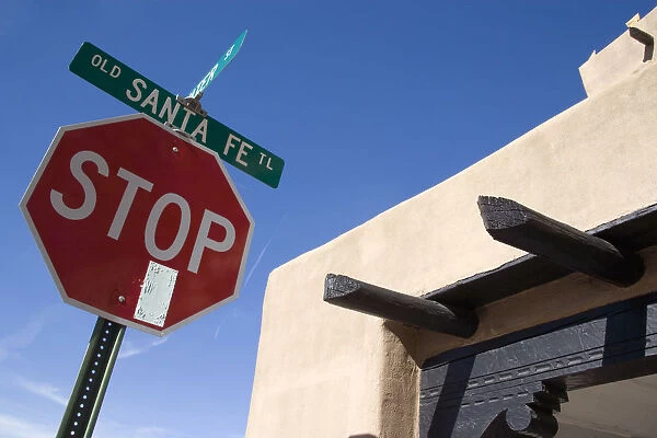 20075979. USA New Mexico Santa Fe Stop sign on the Old Santa Fe Trail beside