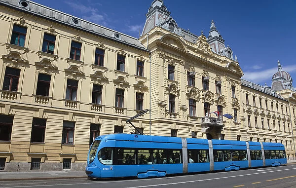 Croatia, Zagreb, Old town, Mihanoviceva Street, Hz Vuca Vlakova national railway headquarters with tram apssing by
