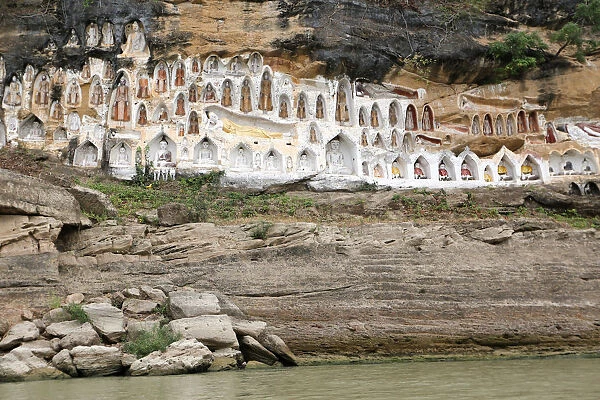 Akauk Taung Buddha cliff carvings pagodas are seen next to the UNESCO world heritage site
