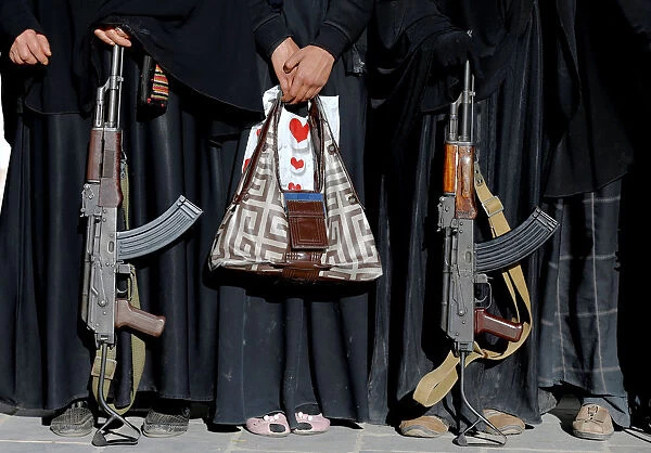 Armed women attend a rally to show support to the Houthi movement in Sanaa, Yemen