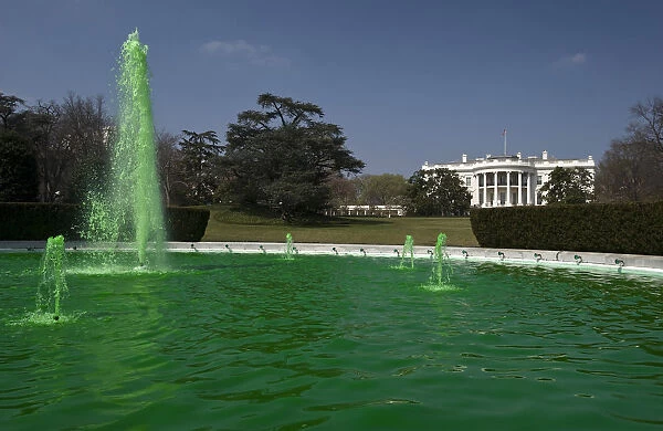 The fountain on the South Lawn of the White House flows with water dyed green for St