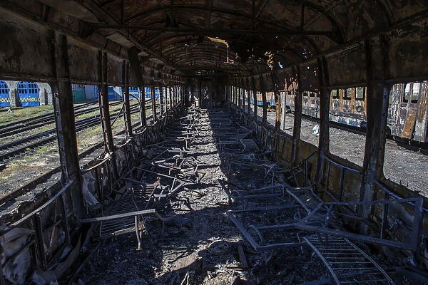 Interior of a burnt-out train is pictured at a railway station in the town of Ilovaysk