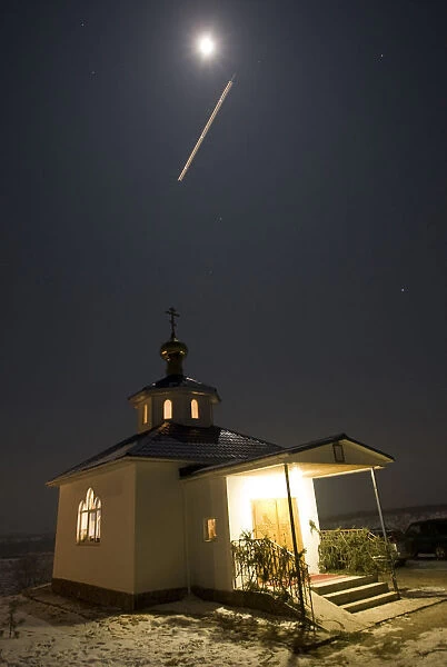 A plane flies above a church during an Epiphany service east of Almaty