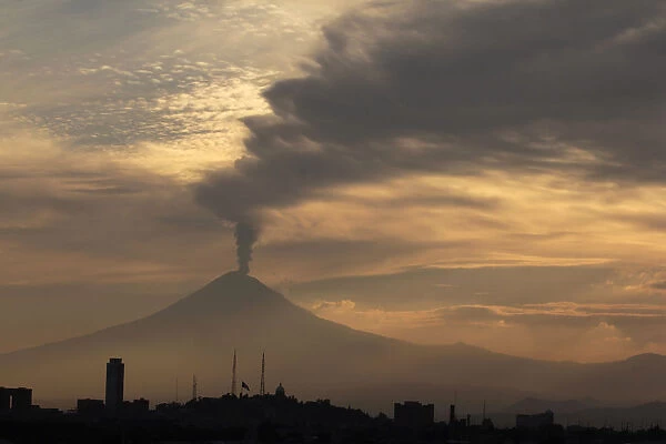 Popocatepetl volcano spews a cloud of ash and steam high into the air in Puebla