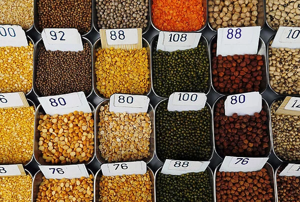 Price tags are seen on the samples of pulses that are kept on display for sale at a