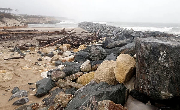 Sea wall on the beach that protect sand dunes from erosion along the Atlantic Ocean coast