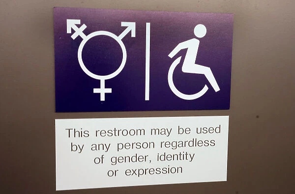 A sign is seen on a gender neutral toilet during the World Economic Forum annual meeting