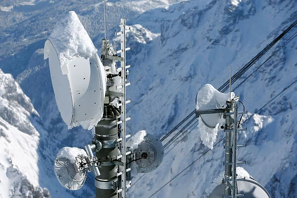 Snow covered transmitting antennas are pictured on top of the highest German mountain