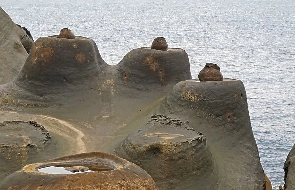 Candle Shaped Rock formation on eroded coastal rock, Yehliu Geopark, Yehliu Promontory, Taiwan, April