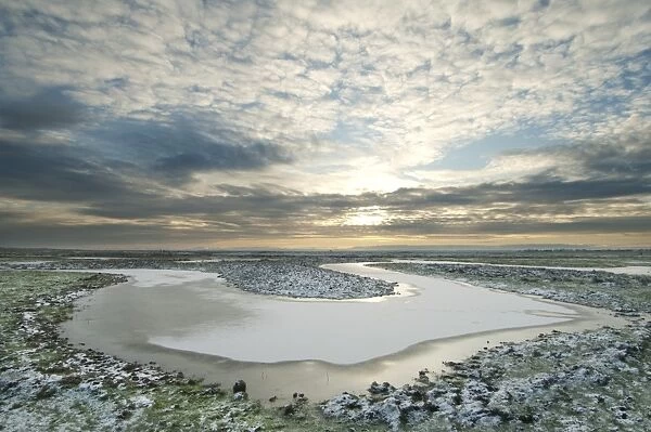 Frozen flooded rill and snow, Elmley Marshes N. N. R. North Kent Marshes, Isle of Sheppey, Kent, England, february