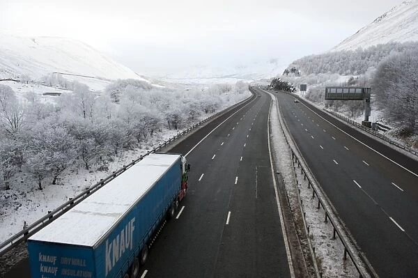 Lorry on motorway in snow, M6 Motorway, Tebay Gap, Cumbria, England, december