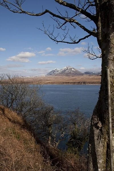 The snow covered Paps of Jura viewed over the Sound of Islay