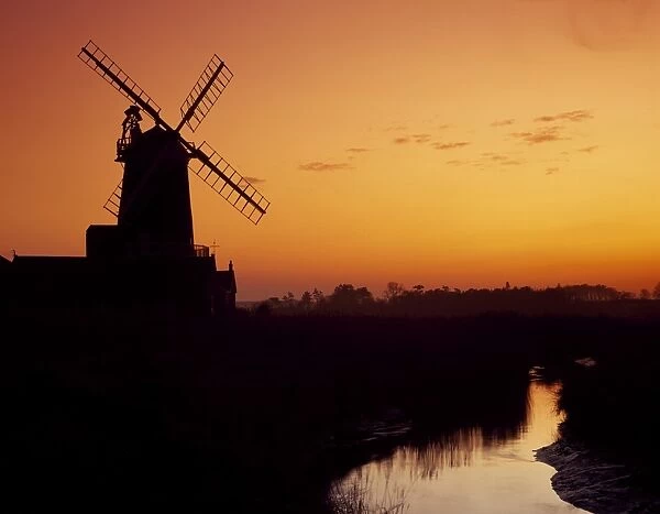 Windmill silhouetted at sunset, Cley Windmill, Cley-next-the-Sea, North Norfolk, England
